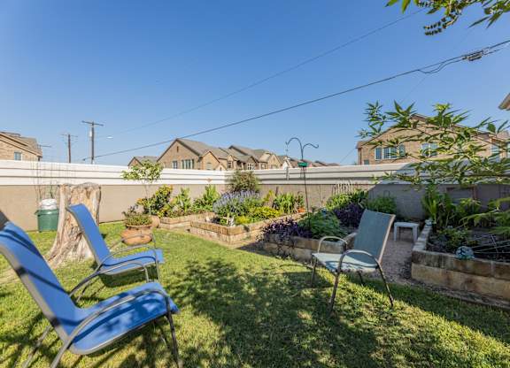 Gardening area with chairs at Encore at Buckingham apartments in Richardson, TX