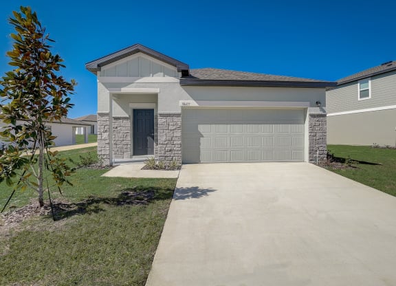 Front view from the driveway of the Elm floor plan at Beacon at Clinton Corners in Dade City, FL