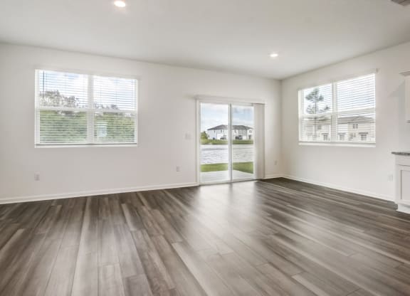 Open-concept living and kitchen area at Beacon at Arbours in Ruskin, FL
