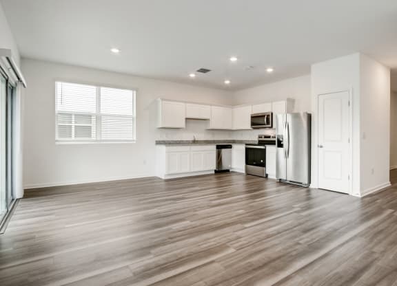 View from living room to kitchen at Beacon at Arbours in Ruskin, FL