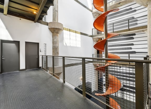Interior hallway with historic chute from Ford factory | Adam Hats Lofts from Deep Ellum Lofts in Dallas, TX