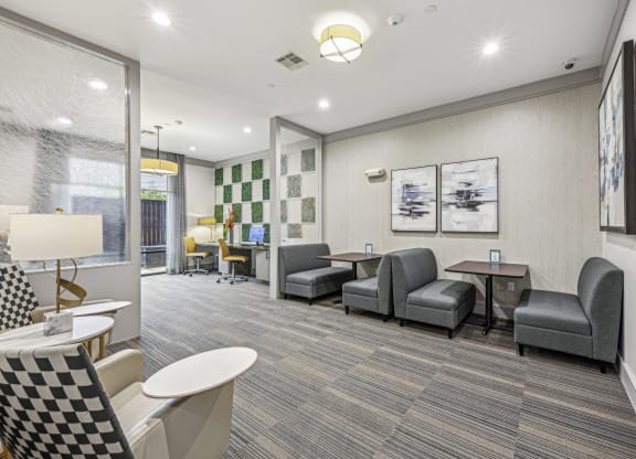 Spacious business center featuring private booths and a contemporary design at Allusion at West University apartments in Houston, TX