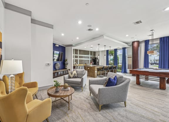 Stylish resident lounge with ample seating and contemporary art at Allusion at West University apartments in Houston, TX