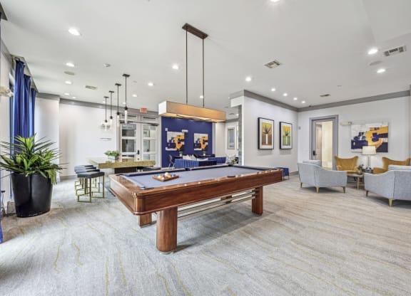 Cozy seating area in a resident lounge with modern decor at Allusion at West University apartments in Houston, TX