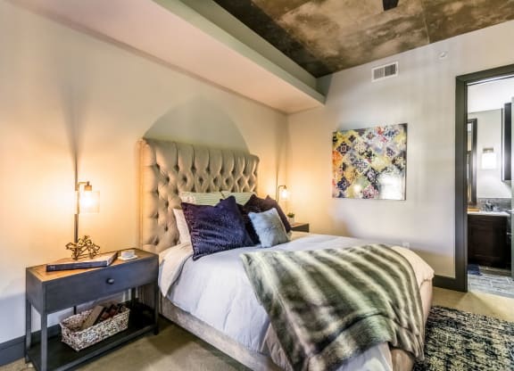 Vaulted ceiling master bedroom in apartment near dallas at The Case Building in Dallas, TX