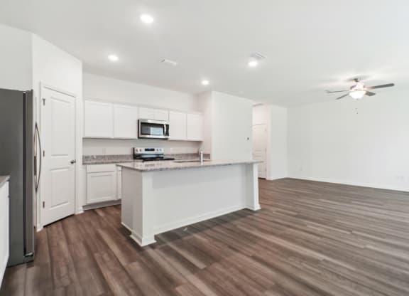 Maple open kitchen and a ceiling fan at Beacon at Ashley River Landing in Summerville, SC
