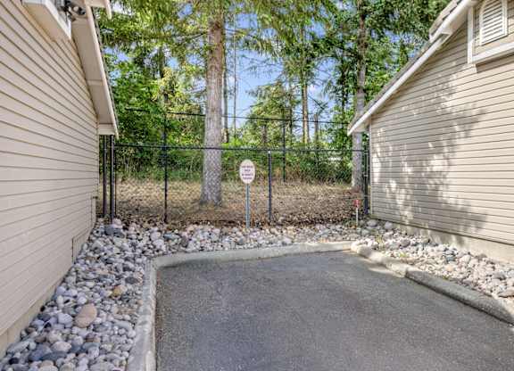 A car wash area with trees behind it at Abbey Rowe Apartments in Olympia, WA