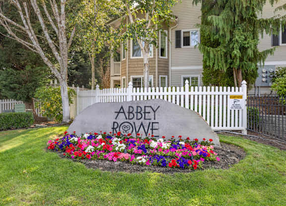 An entry sign for Abbey Rowe Apartments in Olympia, WA