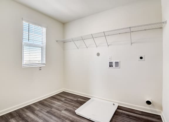 Ash utility room with washer and dryer connections at Beacon at Ashley River Landing in Summerville, SC