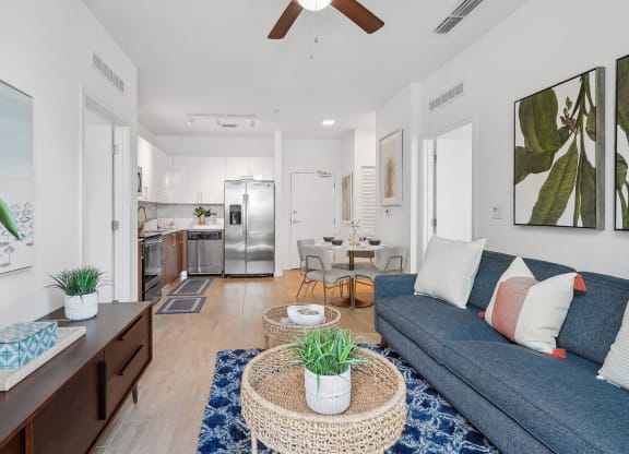 a living room with a blue couch and a coffee table