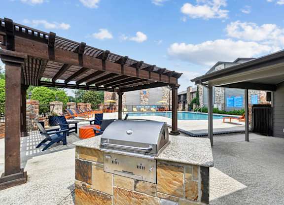Pool and grill at Brighton Place in Lewisville, TX