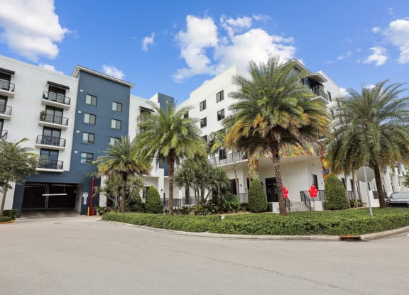 Shot of our building and entrance to parking garage with automatic gates at Bay Village 1 in Palmetto Bay, FL