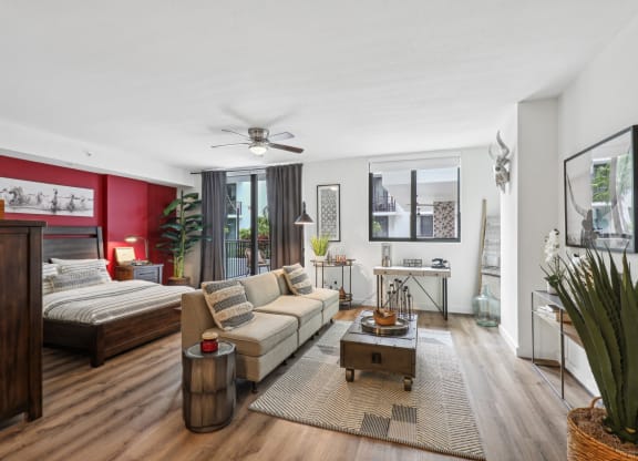 a living room with a couch and a bed