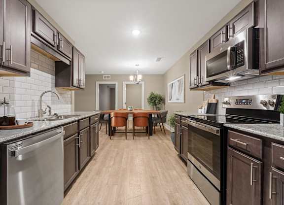 3 Bedroom Unit| Virtually Staged Kitchen at Capital Grand in Tallahassee, FL