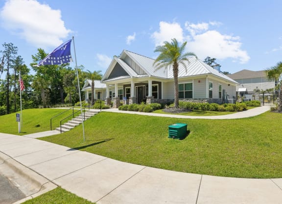 The front of the leasing office with Westdale flag at Capital Grand Apartments in Tallahassee, FL