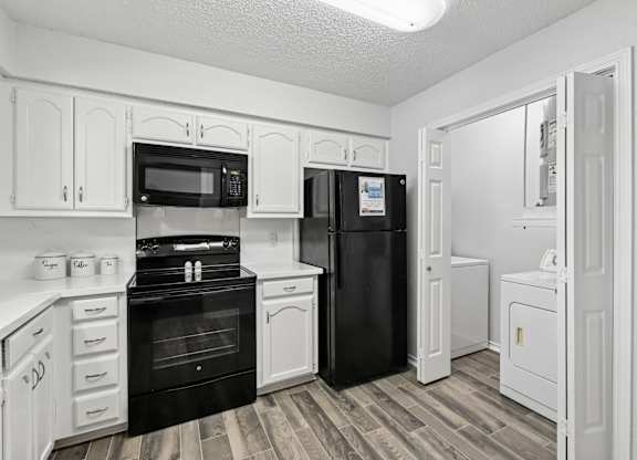 Model unit kitchen at Chisholm Place in Plano, TX