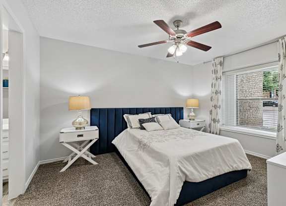 Model unit bedroom at Chisholm Place in Plano, TX