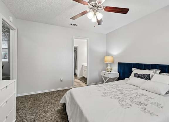 Model unit bedroom at Chisholm Place in Plano, TX