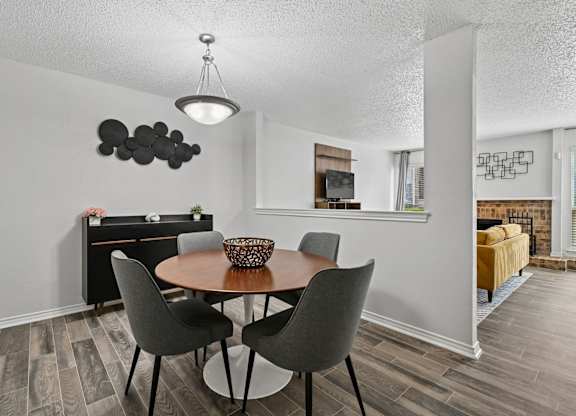 Model unit dining room at Chisholm Place in Plano, TX