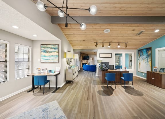 a resident clubhouse with hardwood flooring and wooden ceilings