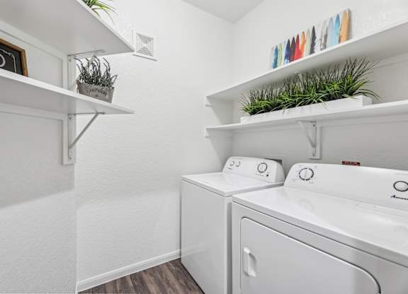 B3 laundry room with a  full size washer and dryer at Creekside on Parmer Lane Apartments in Austin, TX