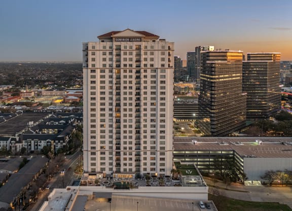 an aerial view of the Dominion Post Oak at dusk in Houston, TX