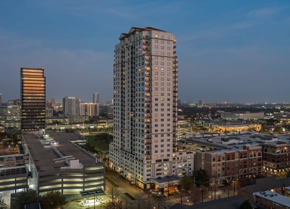 a view at night of the building at Dominion Post Oak in Houston, TX