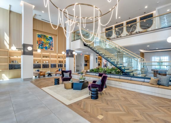 Lobby area with string light chandelier at Era Apartments in Denton, TX