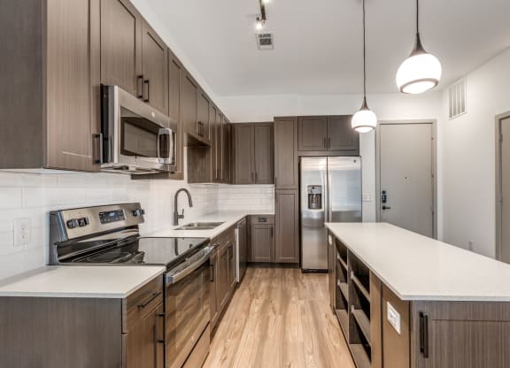 Modern Kitchen with Stainless Steel Appliances at Era Apartment in Denton, TX