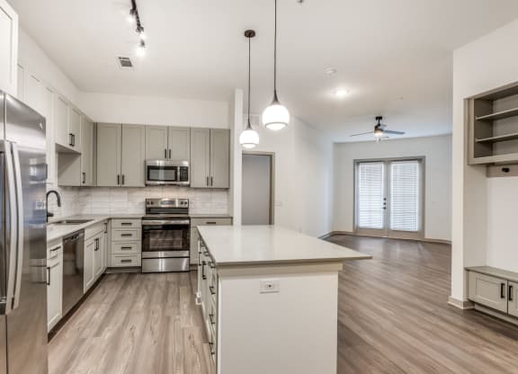 Spacious kitchen with kitchen island in 2 bedroom apartment at Era Apartment in Denton, TX