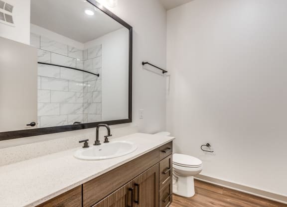 Elegant Bathroom Design with Modern Fixtures at Era Apartment in Denton, TX