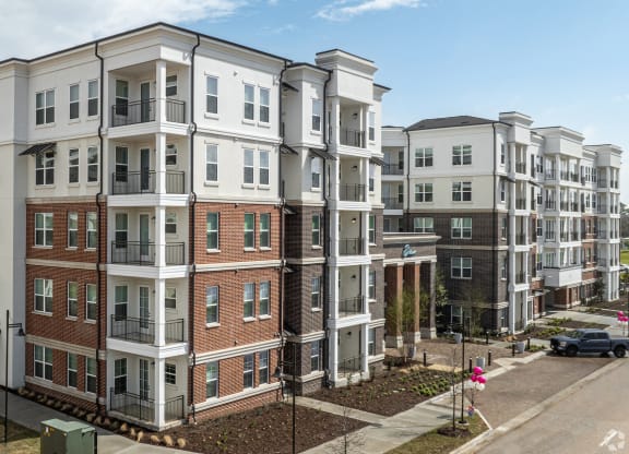 Sideview of main entrance for Era apartments in Denton, TX