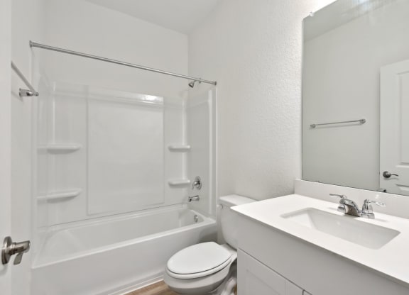 a bathroom with a sink toilet and bathtub