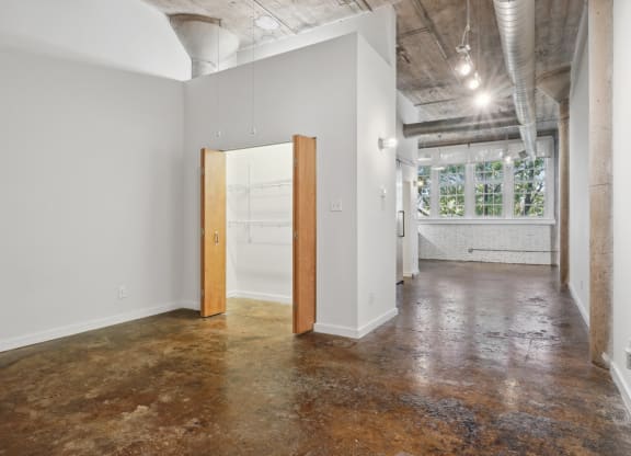 an empty room with a door in the middle of it