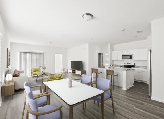 a living room and kitchen with dining tables and chairs