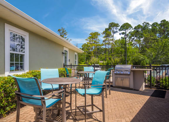 Outdoor grill area perfect for barbecues at Angel Landing apartments in Pensacola, FL