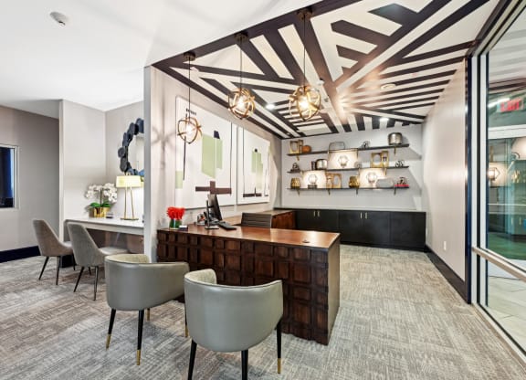 Leasing office featuring a cozy lounge area for residents at Harlow River Oaks apartments in Houston, TX