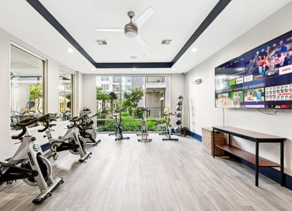 Spin cycle studio with immersive lighting and sound system at Harlow River Oaks apartments in Houston, TX