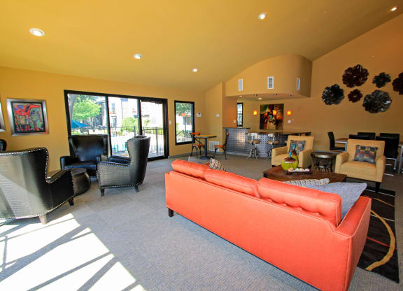 leasing office with an orange couch at Westdale Parke in Austin, TX