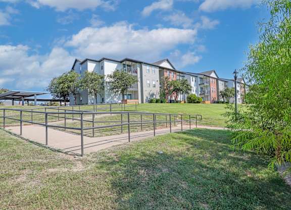 Rampway with apartments and parking lot in the background at Ultris Island Park in Shreveport, LA
