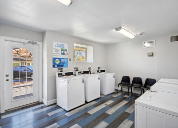 a laundry room at Johnston Creek Crossing in Charlotte, NC