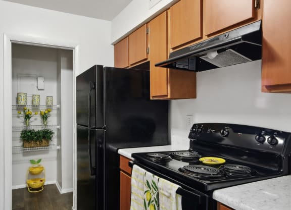 a kitchen with black stove at Johnston Creek Crossing in Charlotte, NC
