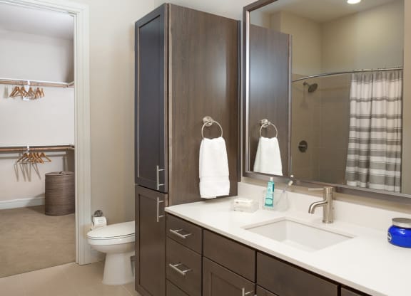 bright bathroom with a big mirror at Knox Heights in Dallas, TX