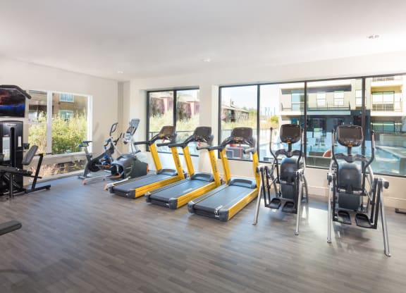 fitness center with treadmilols and elipticals at Knox Heights in Dallas, TX