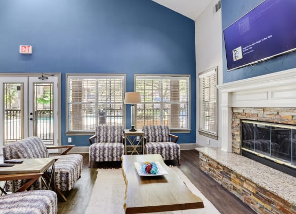a living room with blue walls and a fireplace