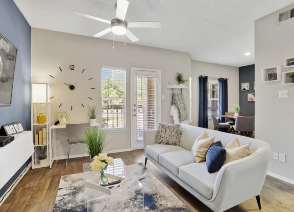 a living room with a large clock on the wall