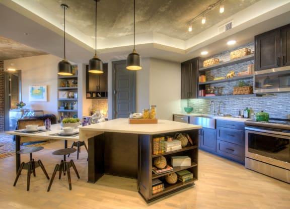 Open floor plan layout of kitchen in apartment with island at The Case Building in Dallas, TX
