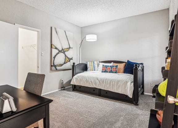 Stylishly furnished model bedroom at Laurels of Sendera apartments in Arlington, TX