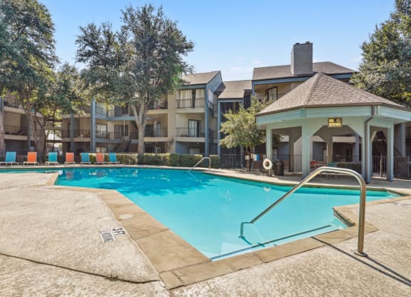 Crystal-clear pool at Laurels of Sendera apartments in Arlington, TX