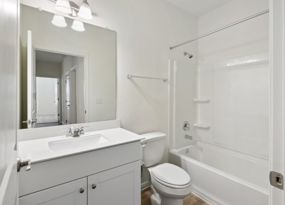 a bathroom with a sink toilet and bathtub